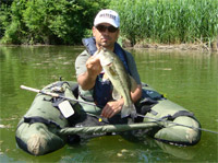     Black Bass in belly boat  